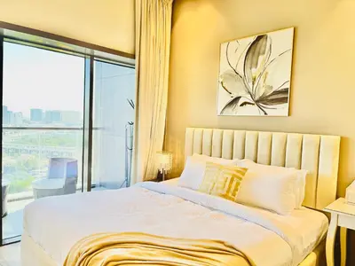 a bedroom with a large bed with a large window at Spacious Spectacular Skyline View in Heart of Dubai in Dubai