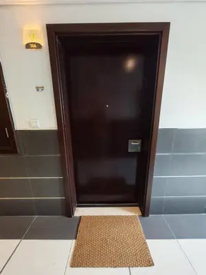 a door in a room with a mat in front of it at Silicon Heights II in Dubai