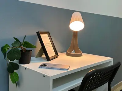 a desk with a lamp and a mirror on it at Partition Room with window In Barsha Near Metro in Dubai
