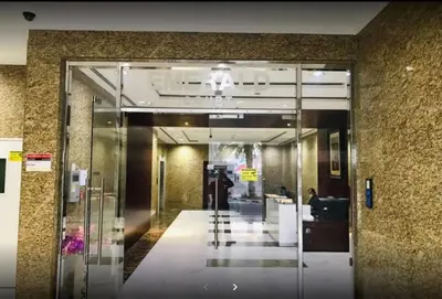 an entrance to a building with a glass door at Partition Room with window In Barsha Near Metro in Dubai