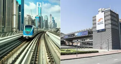 a train is on the tracks in a city at Partition Room with window In Barsha Near Metro in Dubai