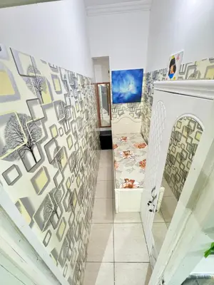 a hallway with a wall mural with a fireplace at Cool valley homes in Dubai
