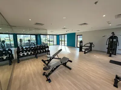 a gym with several treadmills and machines in it at Luxuriöser Aufenthalt mit Blick auf den Burj Khalifa in Dubai