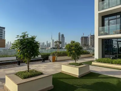 two potted trees in a courtyard in a building at Luxuriöser Aufenthalt mit Blick auf den Burj Khalifa in Dubai