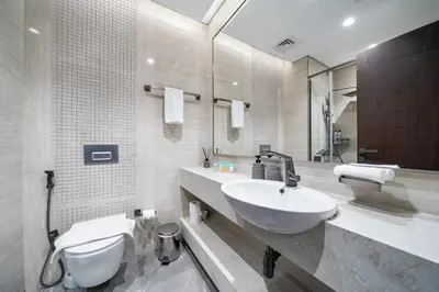 a bathroom with a sink and a toilet at Luxe 3BDR Panoramic Burj Khalifa Views Business Bay in Dubai