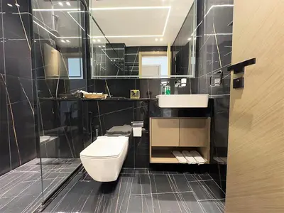 a bathroom with a toilet and a sink at Luxurious new 1 bedroom with Balcony and New Building in Dubai