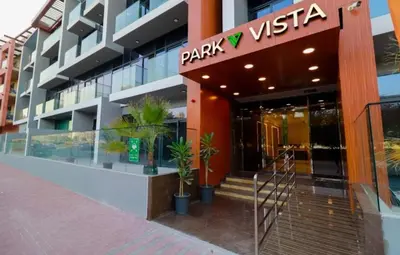 a building with a park vista sign on it at Luxuriously Designed Spacious Studio In JVC in Dubai