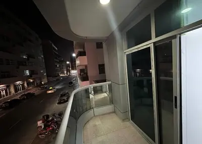 a view of a city street at night from a building at Loft Room in Al Barsha 1 Near MOE Metro in Dubai