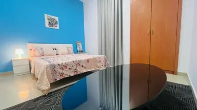 a bedroom with a bed and a glass table at Newly Furnished Room in Barsha 1 Near MOE in Dubai