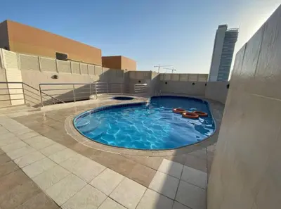 a large swimming pool in the middle of a building at Newly Furnished Room in Barsha 1 Near MOE in Dubai