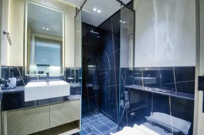 a bathroom with a sink and a shower at AWS Holiday Homes - Dreamful Views of the Burj in Dubai