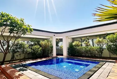 a swimming pool in the backyard of a house at 85m2 En Suite, DIFC in Dubai