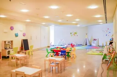 a classroom with a table and chairs in a room at 85m2 En Suite, DIFC in Dubai