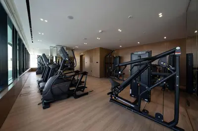 a gym with treadmills and cardio equipment in a building at Chic & Modern 1br In Jvc With Full Amenities in Dubai