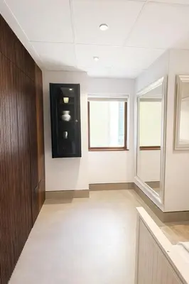 a room with a black cabinet and a window at Modern Marina Escape 4BR Family Retreat at JBR in Dubai