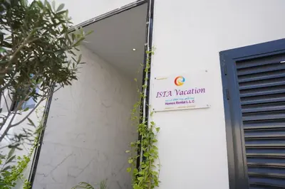 a sign on the side of a building at Ista Vacation Homes Rental LLC KARAMA in Dubai