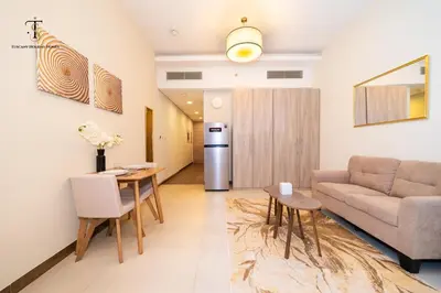 a living room with a couch and a table at Splendid City Views Studio- SOL BAY Business Bay in Dubai