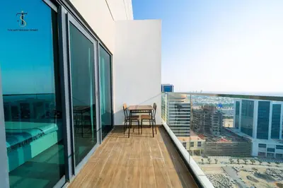 a balcony with a table and chairs on a building at Splendid City Views Studio- SOL BAY Business Bay in Dubai