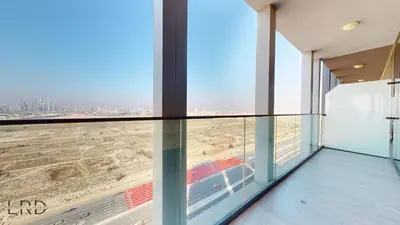a glass balcony with a view of the city at Spacious 3BR Apartment in Dubai