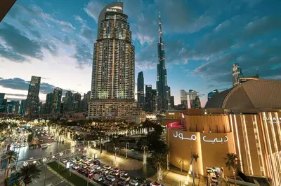 a city skyline with a lot of tall buildings at Luxe 1BR with Full Burj Views and Dubai Mall Access in Dubai