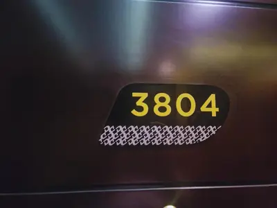 a digital clock on the side of a microwave at Damac Upper Crest - Blue Ocean Holiday Homes in Dubai