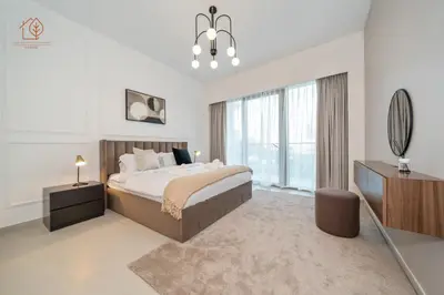 a bedroom with a large bed and a mirror at Burj Khalifa Views 2-Bedroom Apartment 203GR-2 in Dubai