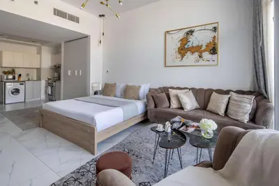 a living room with a couch and a table at Frank Porter - Millennium Binghatti Residences in Dubai