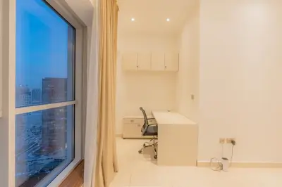 an office with a desk and a large window at Luxury 3BR Stunning Burj Khalifa View in Dubai