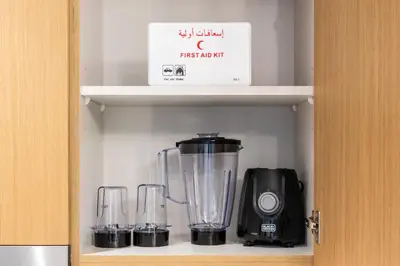 a blender and two glasses on a shelf at Luxury 2 Bedroom in Golf Suites Dubai Hills in Dubai