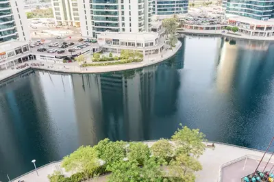 an aerial view of a river in a city at Chic Studio in Goldcrest Views, JLT in Dubai