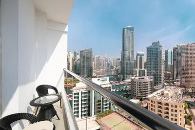 a view of a city from the balcony of a building at Cozy Urban 2BR Apartment in DEC Tower Marina in Dubai