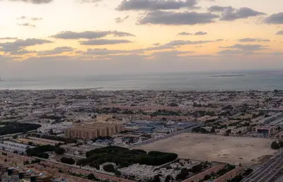 an aerial view of a city with the ocean at Stunning 3BR w Panoramic Views in Aykon City in Dubai
