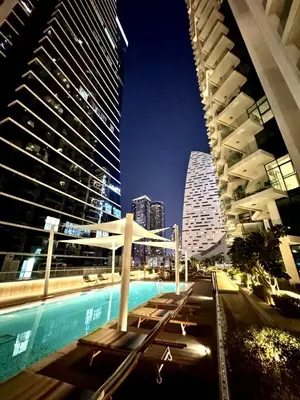 a view of a city at night with tall buildings at Mahogany 2 - 2BR 6PAX - Infinity Pool & Near Metro in Dubai
