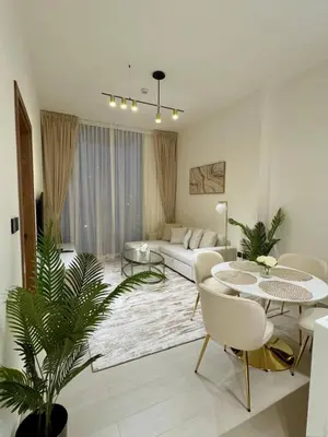 a living room with a couch and a table at Chic & Modern 1br Apt Balcony Pool Parking in Dubai