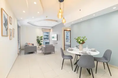 a dining room with a table and chairs at Sophisticated and Elegant 2BR in Downntown Dubai in Dubai