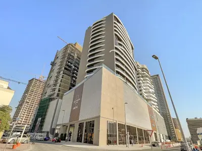 a tall building in a city with tall buildings at FIRST CLASS Studio Stylish Living in Dubai