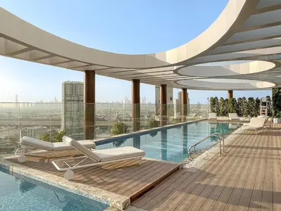 a swimming pool on the roof of a building at FIRST CLASS Studio Stylish Living in Dubai