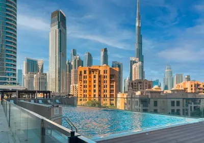 a large swimming pool on top of a city skyline at DreamShoma-1B Spacious Apartment in Dubai