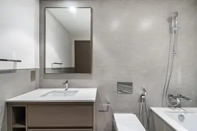 a bathroom with a sink and a mirror at The Smart Concierge - Signature Grande in Dubai