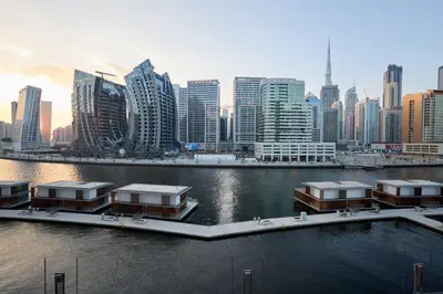 a view of a city with a river and buildings at Full Burj Khalifa & Canal View I 7 Mins to Dubai Mall I Exclusive 2BHK For Up to 6 People in Dubai