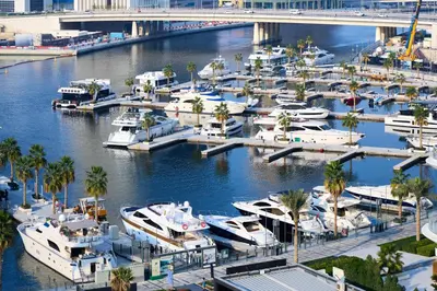 a bunch of boats docked in a marina at Full Burj Khalifa & Canal View I 7 Mins to Dubai Mall I Exclusive 2BHK For Up to 6 People in Dubai
