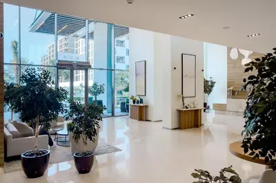 a lobby with potted plants in a building at Apartment in Dubai Hills Park Acacia A in Dubai