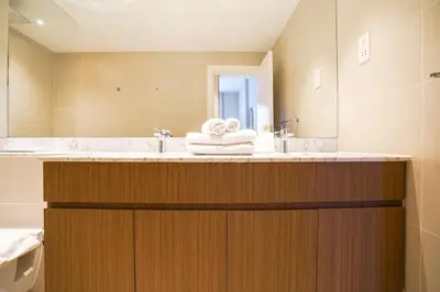 a bathroom with a large tub and a sink at Sea View l Port De LaMer l Next to Beach l Perfect for 4 in Dubai