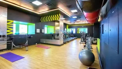 a room with a gym with exercise equipment in it at Serene 2BR with Iconic Palm Jumeirah Views, Dubai Marina by Deluxe Holiday Homes in Dubai