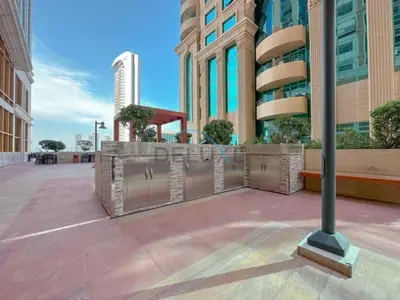 a pole in the middle of a city with buildings at Serene 2BR with Iconic Palm Jumeirah Views, Dubai Marina by Deluxe Holiday Homes in Dubai