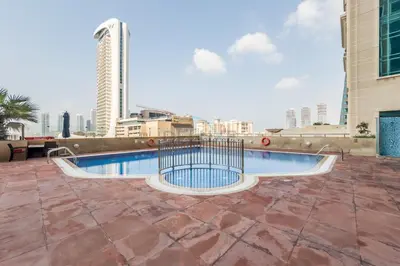 a swimming pool on the roof of a building at Remodeled 1BR with Sky-High Picturesque Marina Views, Elite Residence, Dubai Marina by Deluxe Holiday Homes in Dubai