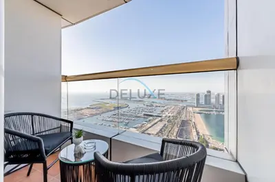 a room with a view of the ocean at Remodeled 1BR with Sky-High Picturesque Marina Views, Elite Residence, Dubai Marina by Deluxe Holiday Homes in Dubai