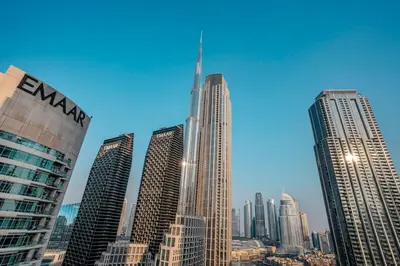 a group of tall buildings in a city at FIRST CLASS 3BR Burj Khalifa & Fountain view in Dubai