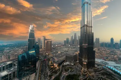 an aerial view of a city with a tall skyscraper at 3BR Family abode with Iconic Burj Khalifa view in Dubai