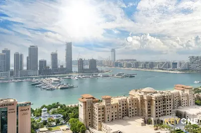 a view of a city with boats in the water at Fascinating Ocean Views in a One Bedroom in Dubai